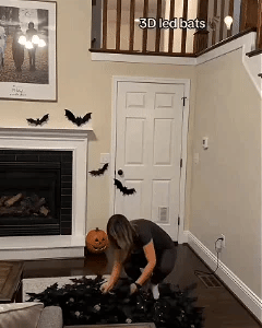 A glowing 3D LED bat wall being created in a home
